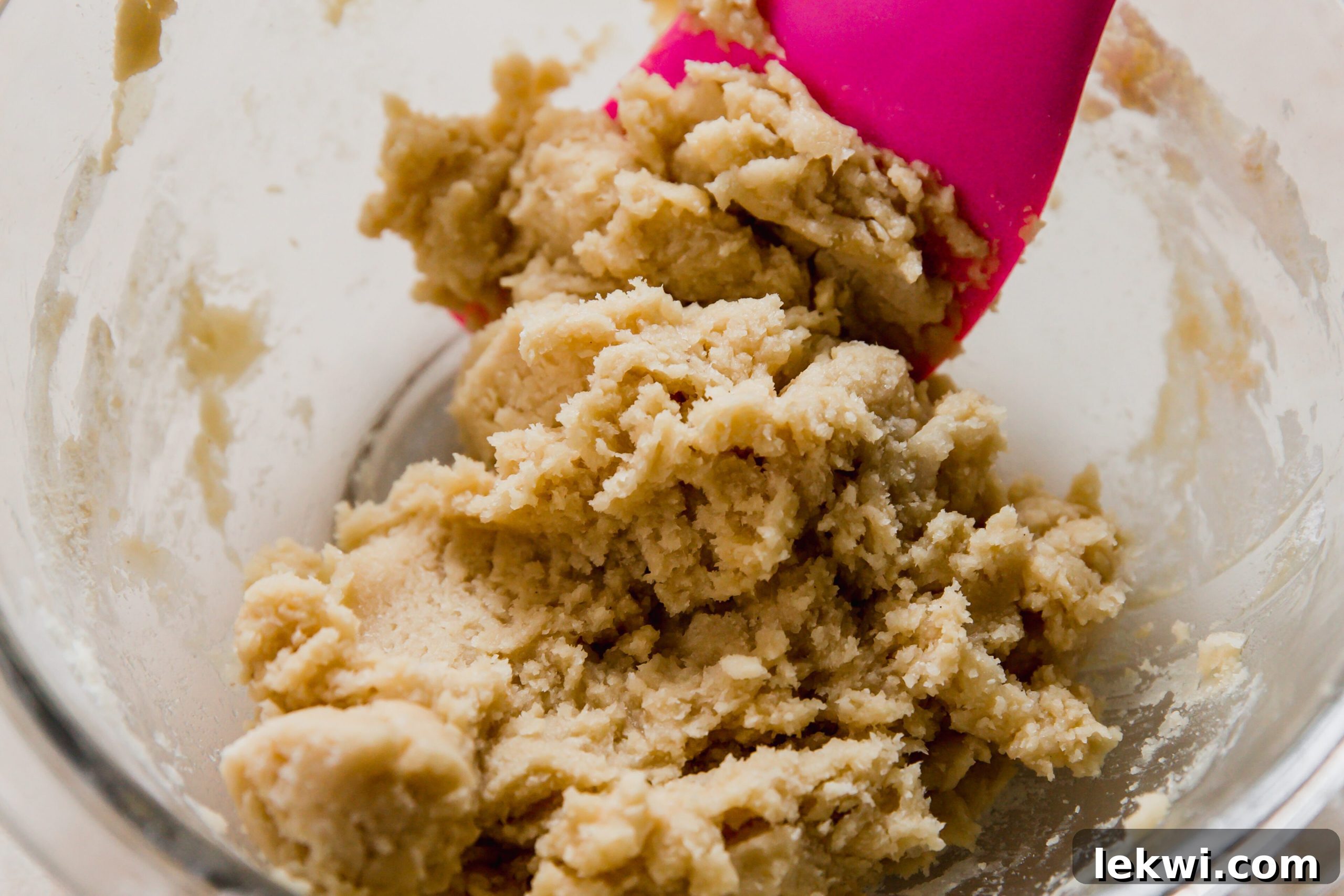 Shortbread crust ingredients being combined in a bowl.