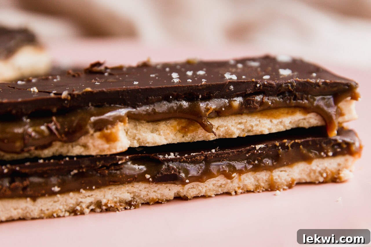 Two finished Twix bars stacked on top of each other, showcasing the layers.