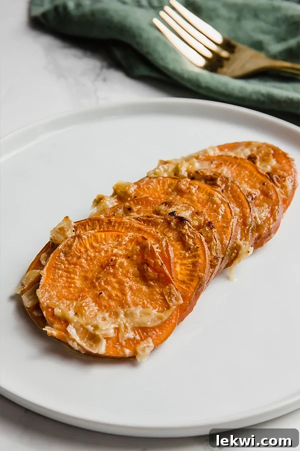 A serving of healthy sweet potato gratin in a white bowl, showing delicious texture.