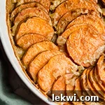 A white bowl filled with sweet potato gratin.