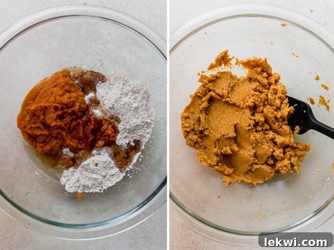 Close-up of a bowl filled with smooth, orange pumpkin roll cake dough, ready to be spread.