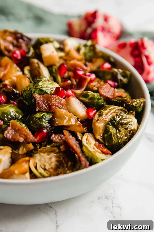 A final serving suggestion image of the roasted Brussels sprouts, apples, and bacon, showcasing the vibrant colors and appealing textures.