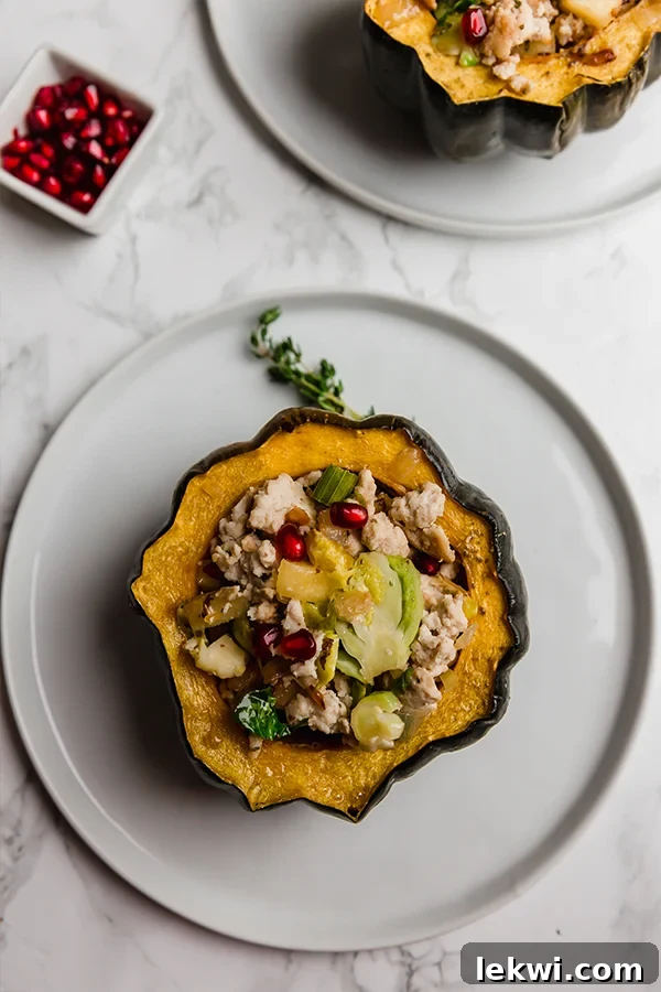 Turkey Stuffed Acorn Squash, showcasing the beautiful golden roasted squash and rich filling.