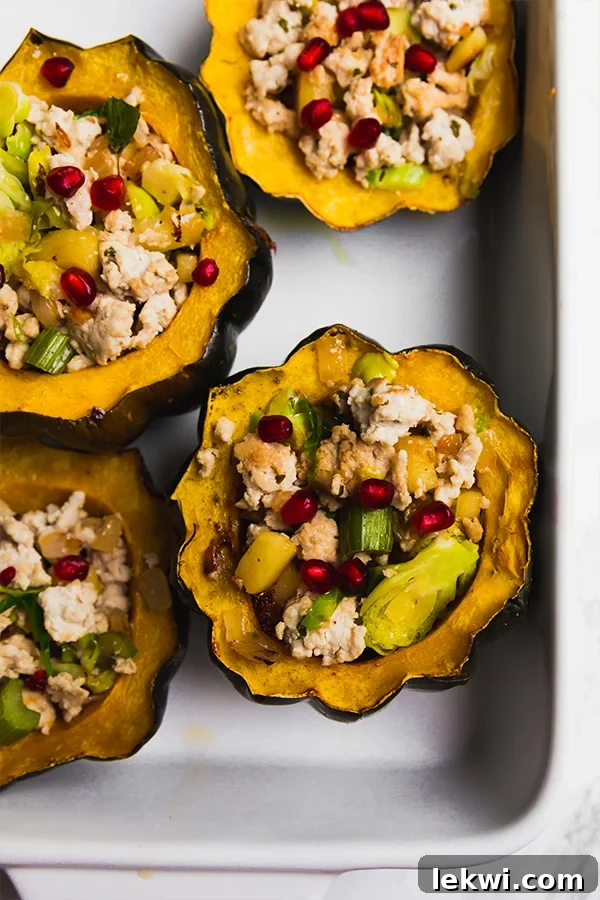 A baking dish with turkey stuffed acorn squashes after baking.