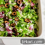 A white baking dish filled with paleo taco dip.