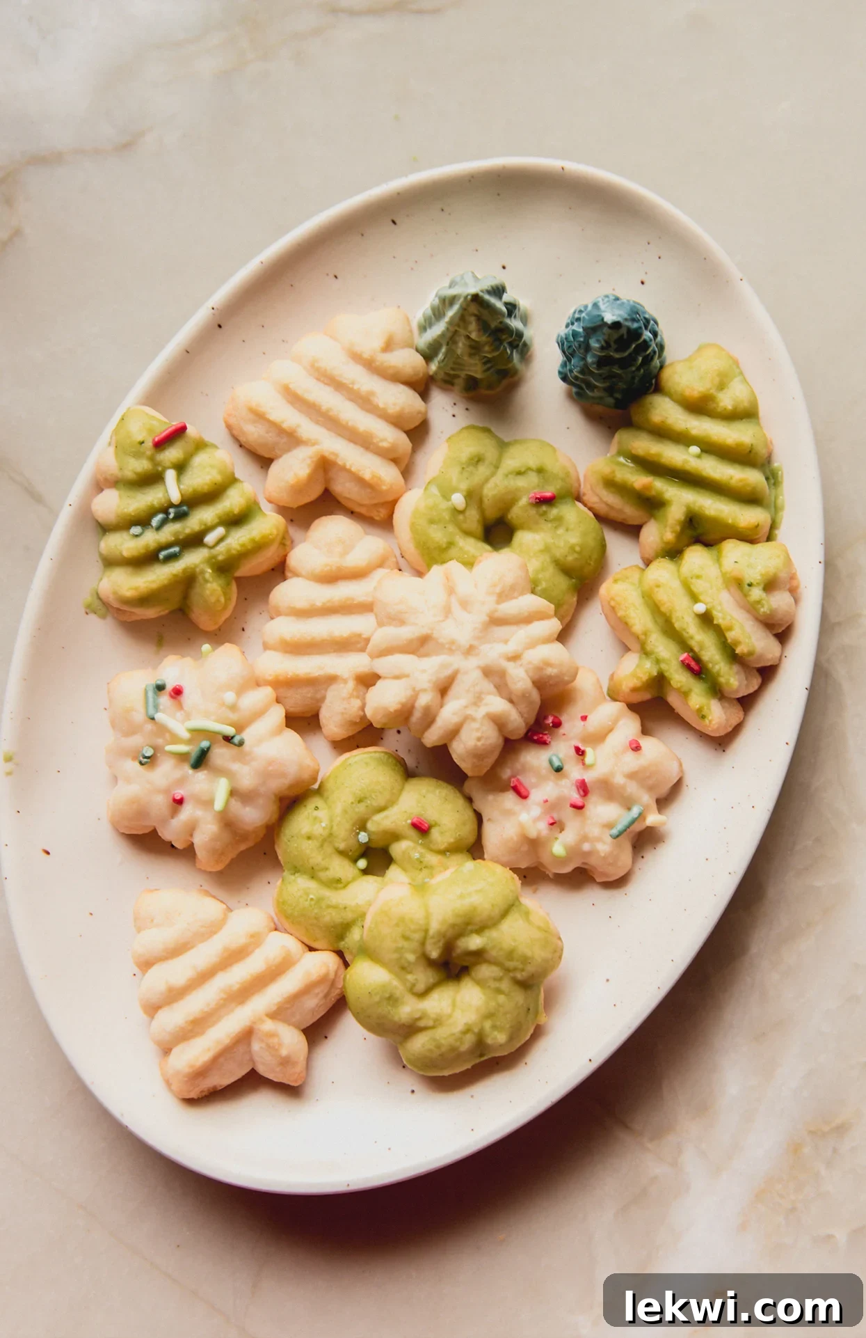 Spritz cookies on a decorative holiday plate.