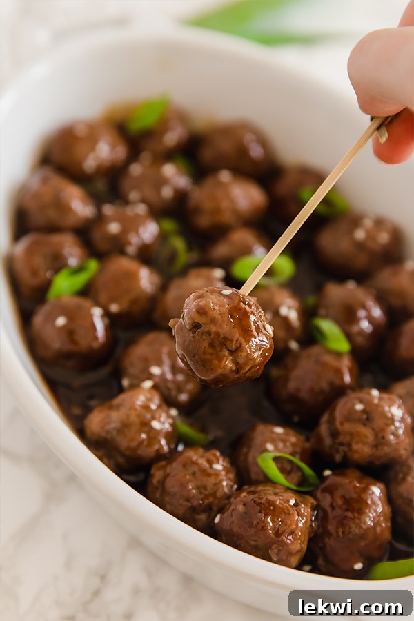 Mongolian Beef Meatballs served as an appetizer with small toothpicks, showcasing their party-friendly presentation and bite-sized appeal.