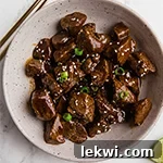 A dish filled with teriyaki bites.