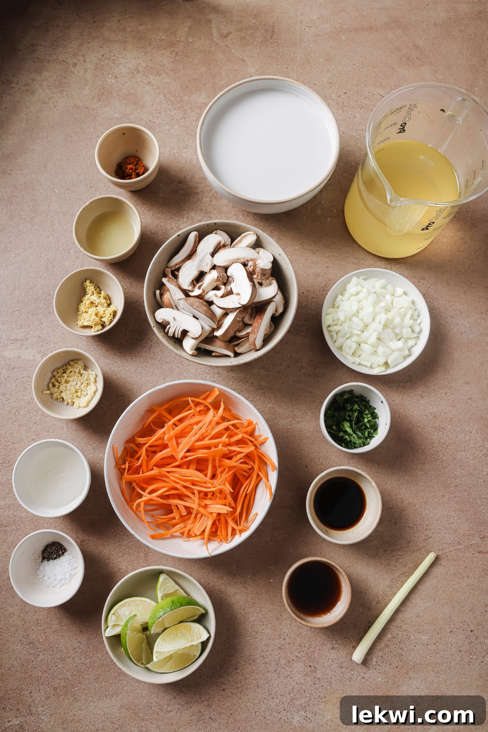 Tom kha soup ingredients in bowls.