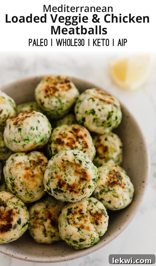 A visually appealing Pinterest-friendly image showing a bowl of Mediterranean veggie & chicken meatballs, garnished with fresh herbs, suitable for sharing on social media and driving engagement.