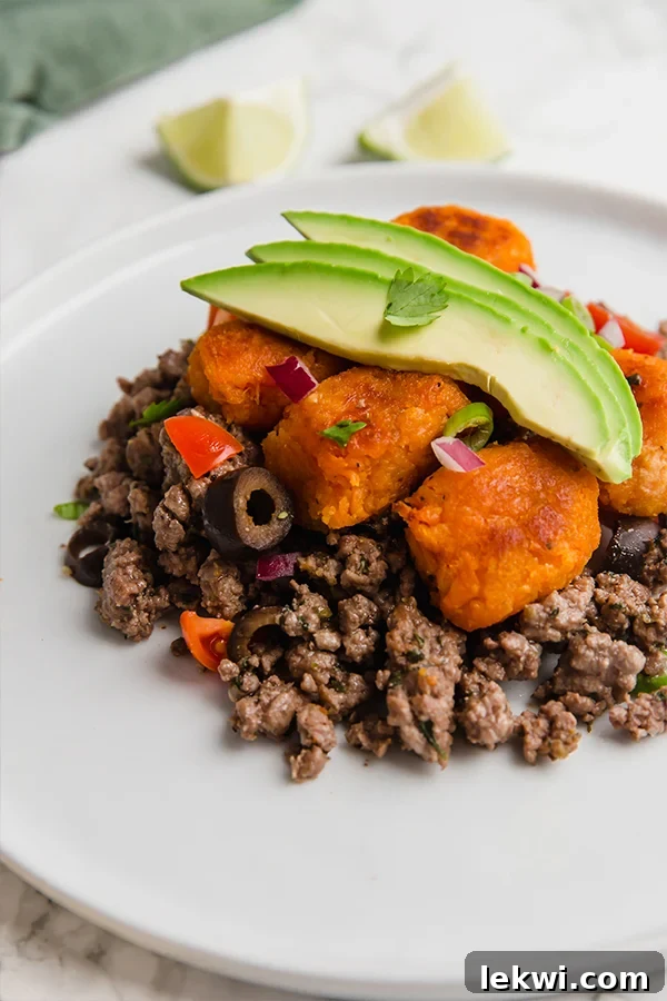 Taco Casserole, a delightful combination of seasoned beef and crispy sweet potato tater tots.
