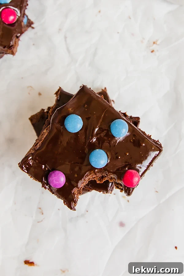 cosmic brownies with a close-up shot of the fudgy texture and ganache