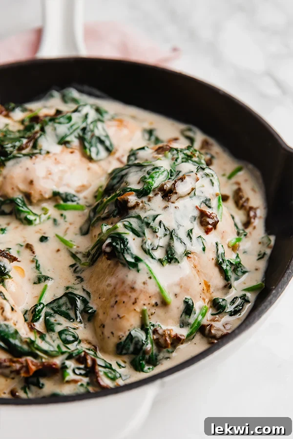 A pan with Tuscan chicken skillet after it has finished cooking.