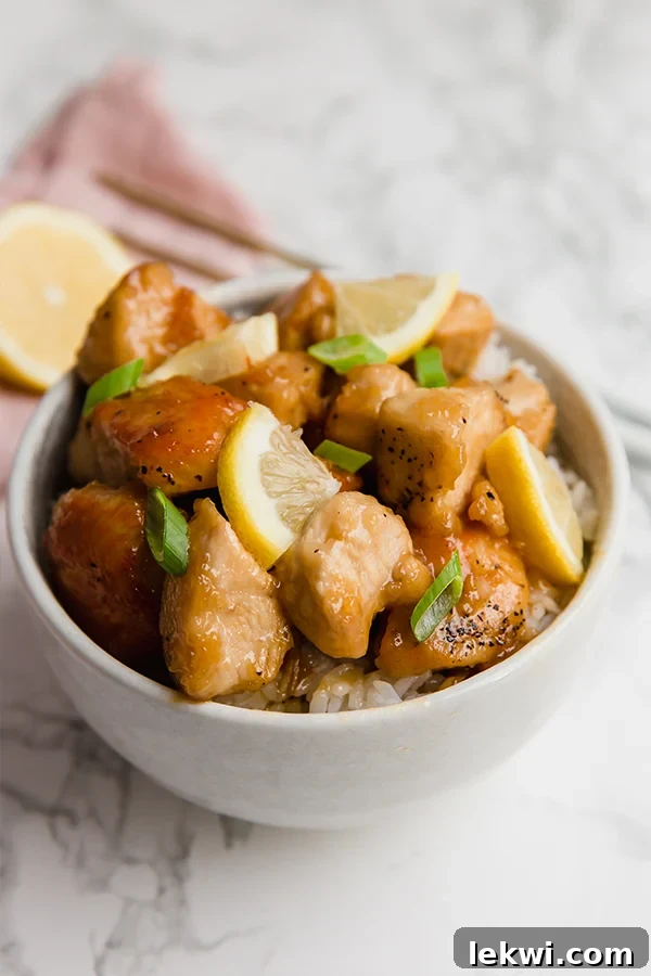 A second view of the sticky Chinese lemon chicken, showing its rich, glossy sauce and tender chicken pieces.