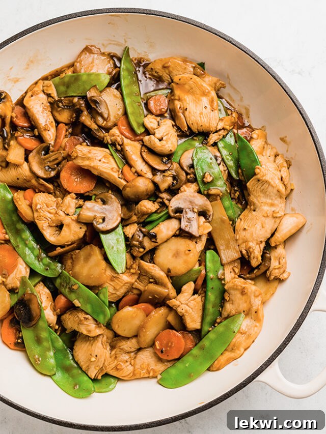 Authentic Chinese Moo Goo Gai Pan, a mushroom chicken stir fry, beautifully plated.