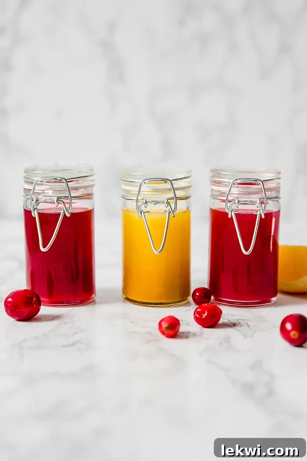Three glass jars with apple cider vinegar shots