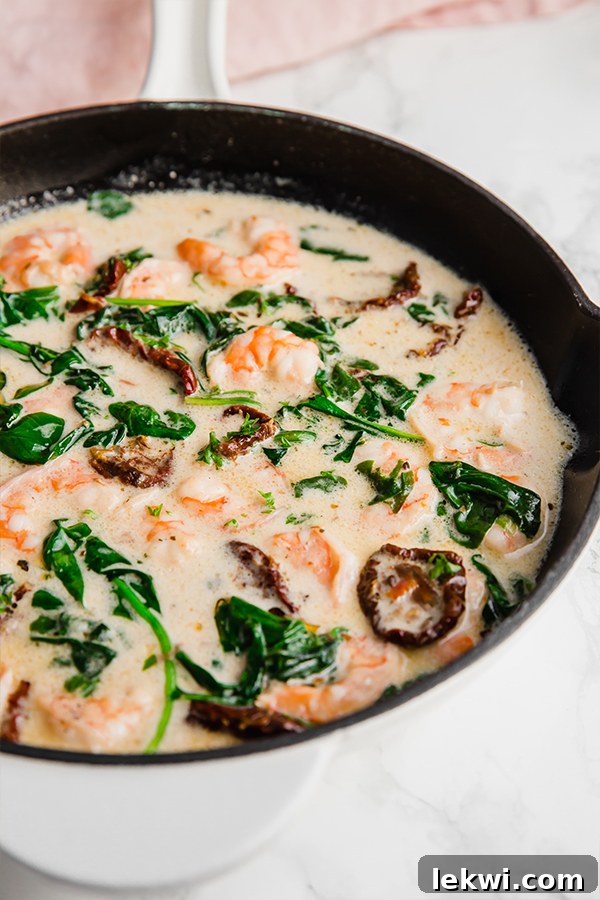 A pan filled with Tuscan shrimp after cooking, before being eaten.