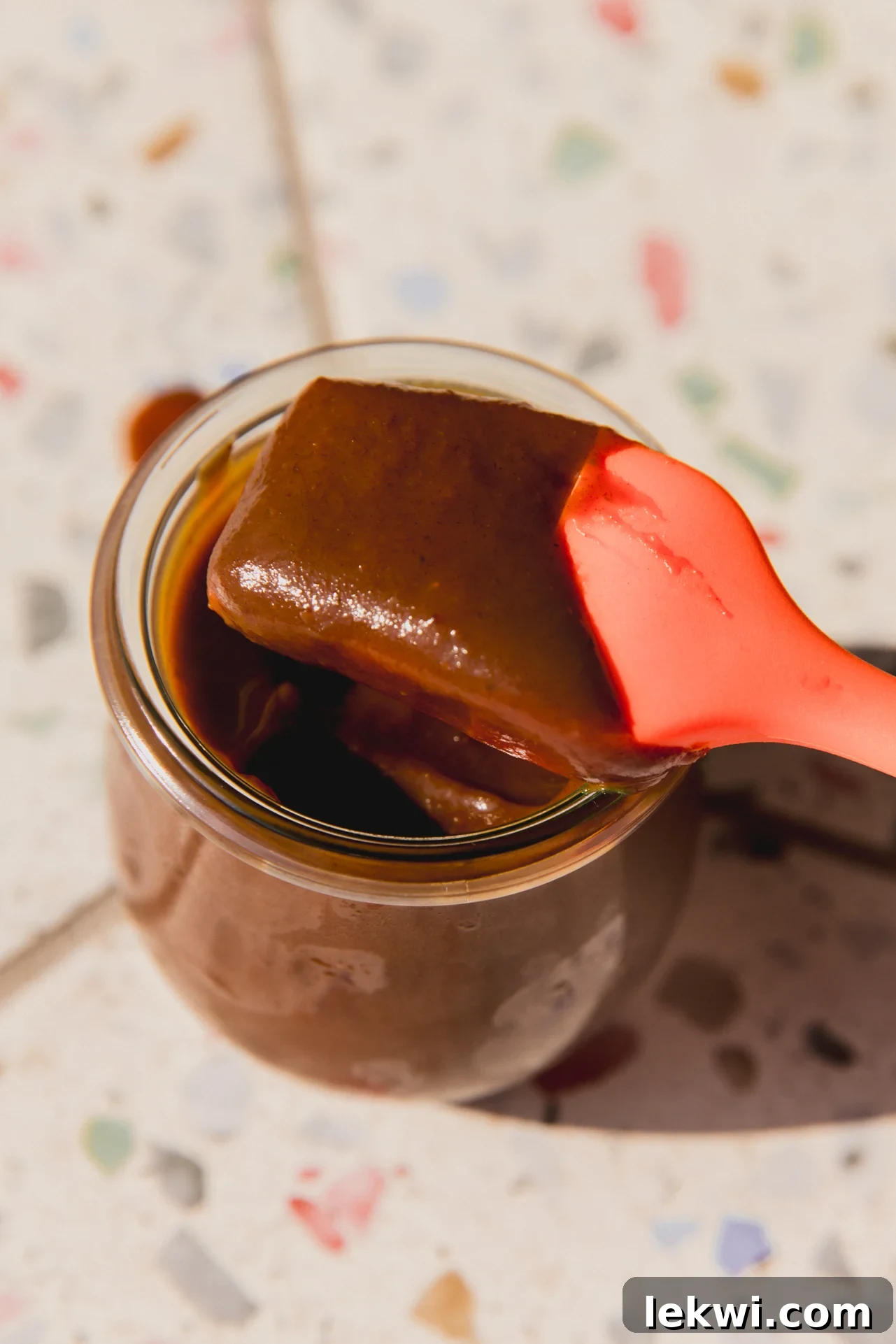 Nightshade free BBQ sauce with spatula dipping in the jar.