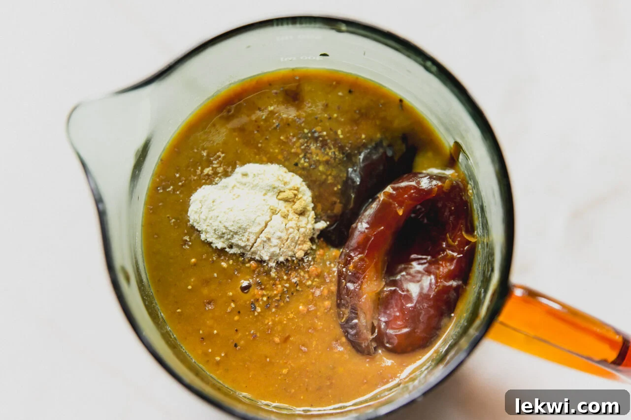 BBQ sauce ingredients in a measuring cup, unblended.