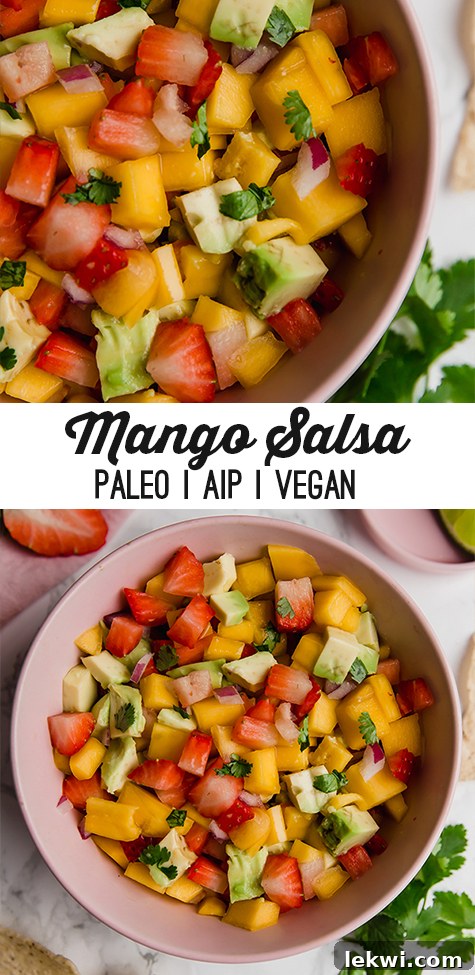 A large, vibrant pin-friendly image of strawberry mango salsa in a clear bowl with chips and a lime wedge in the background.