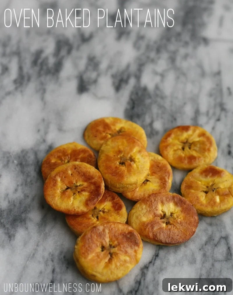 Oven Baked Plantains - Golden brown slices on a baking sheet.