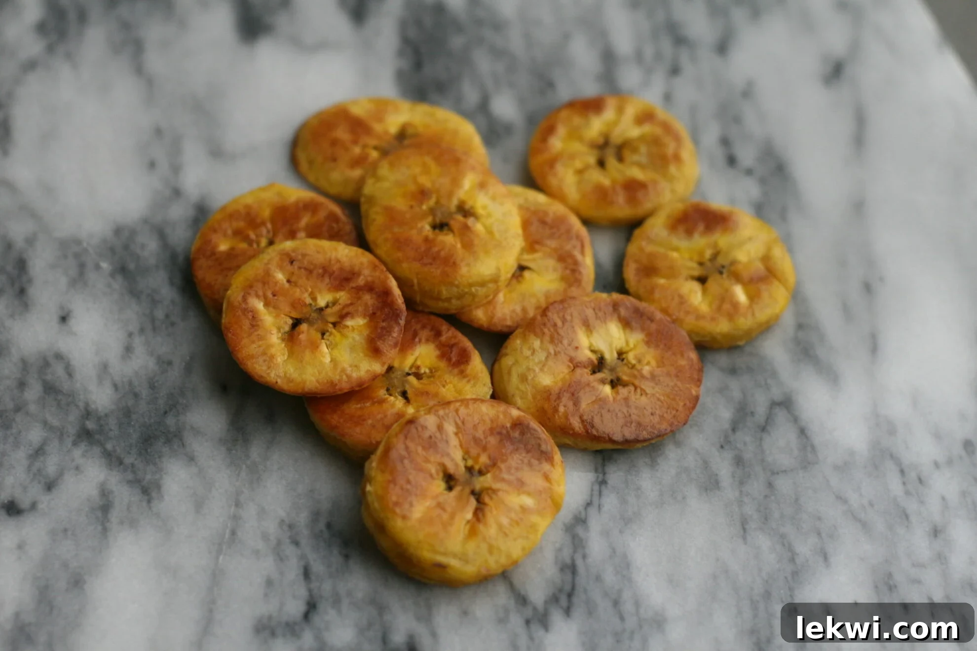 Close up of a serving of golden oven baked plantains.