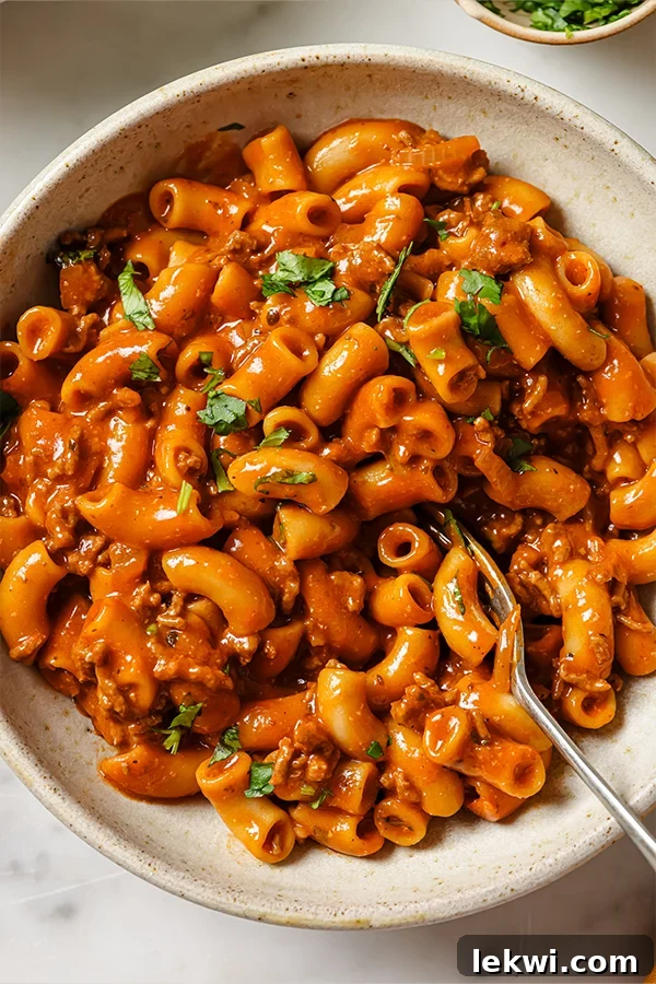 Fork in a dish of Copycat Gluten-Free Hamburger Helper.
