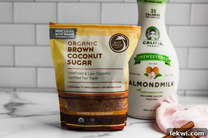 A bag of brown coconut sugar and a carton of almond milk, neatly arranged for making snickerdoodle lattes.