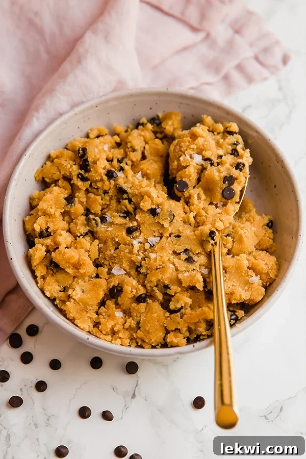 no bake pumpkin chocolate chip cookie dough in bowl with spoon