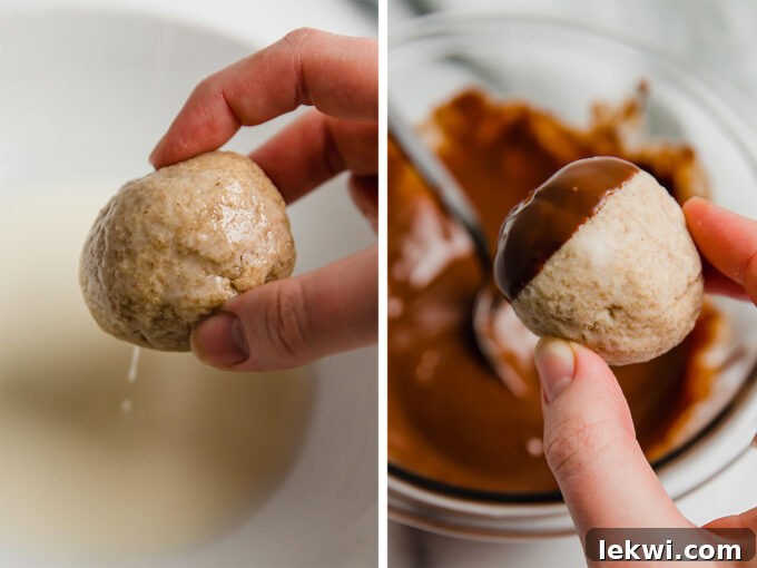 Donut holes dipped in a smooth glaze and rich chocolate, ready for the pretzel stem.