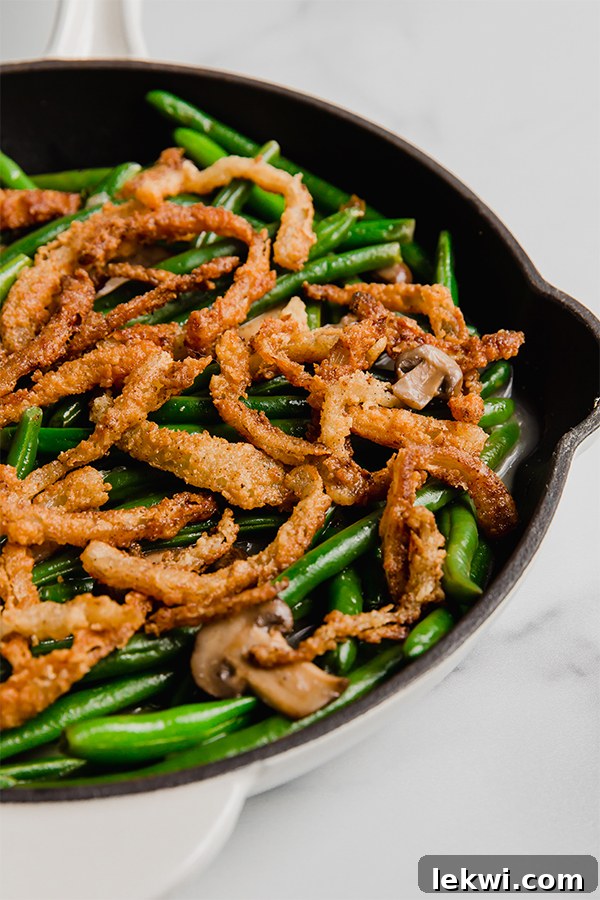 Green bean casserole in a skillet, ready to be served.