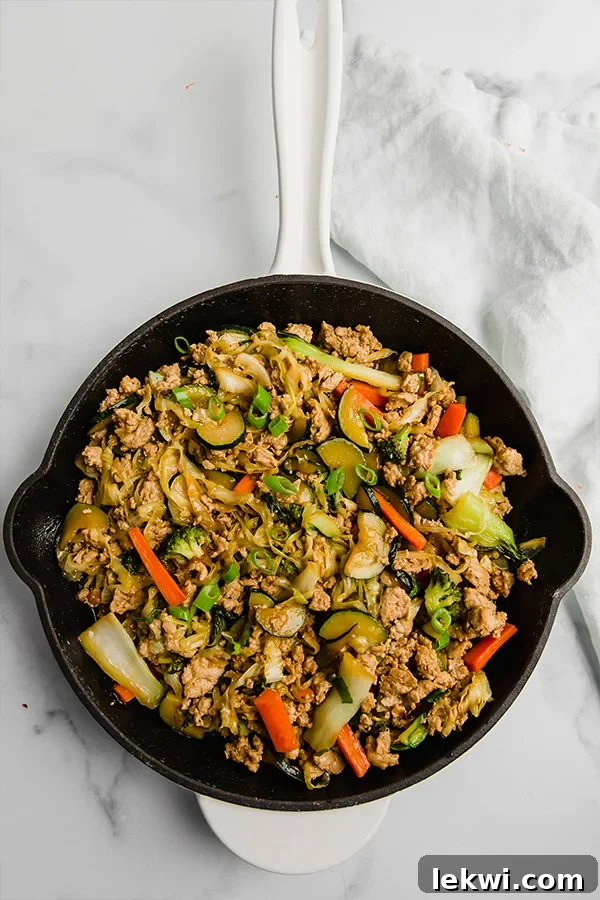 ground turkey and vegetable teriyaki stir fry in cast iron skillet