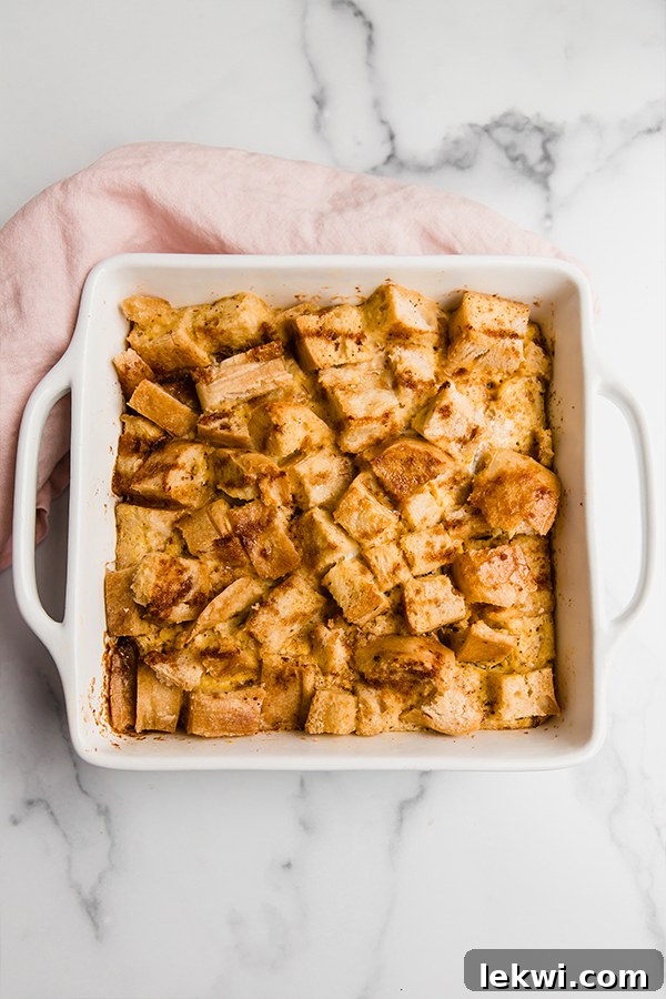 Full baking dish of gluten-free french toast casserole with steam rising, ready to be served.