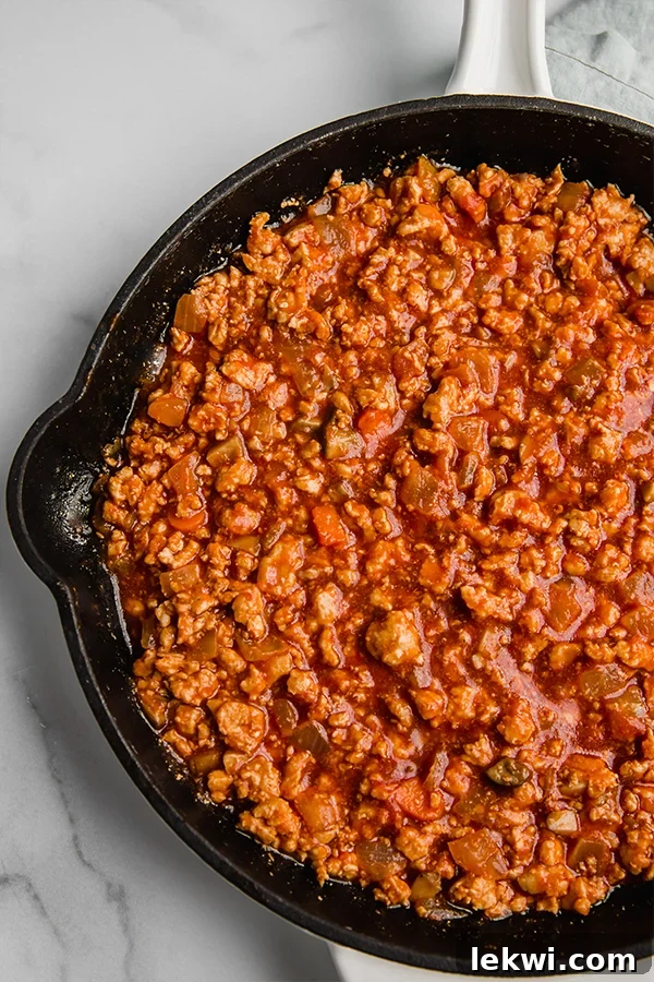 Turkey sloppy joe cooked in a black pan, ready to serve.