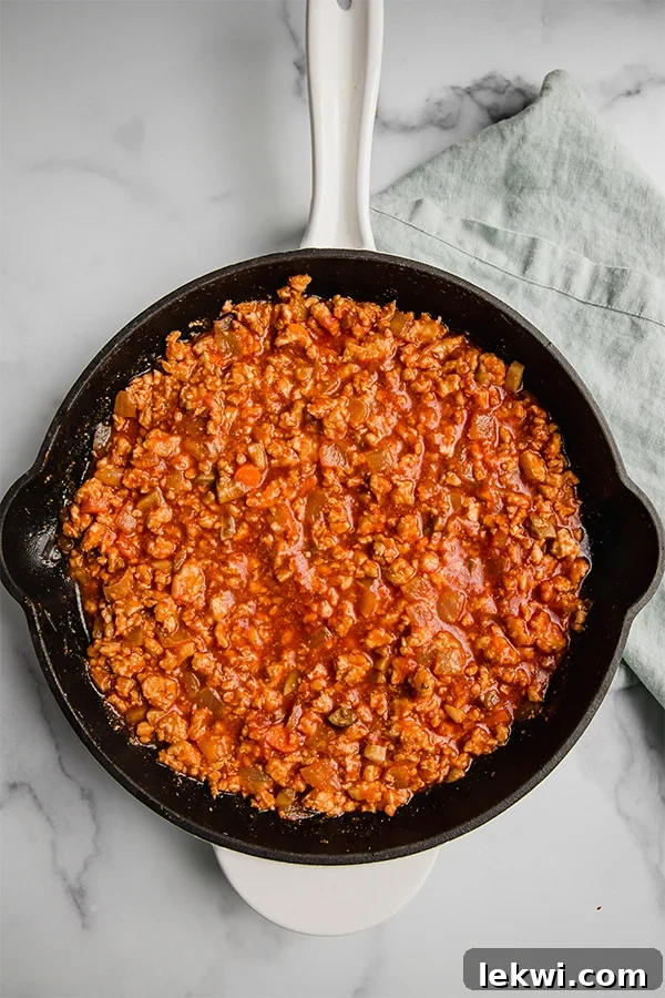 Turkey sloppy joe in a cast iron skillet, freshly cooked.