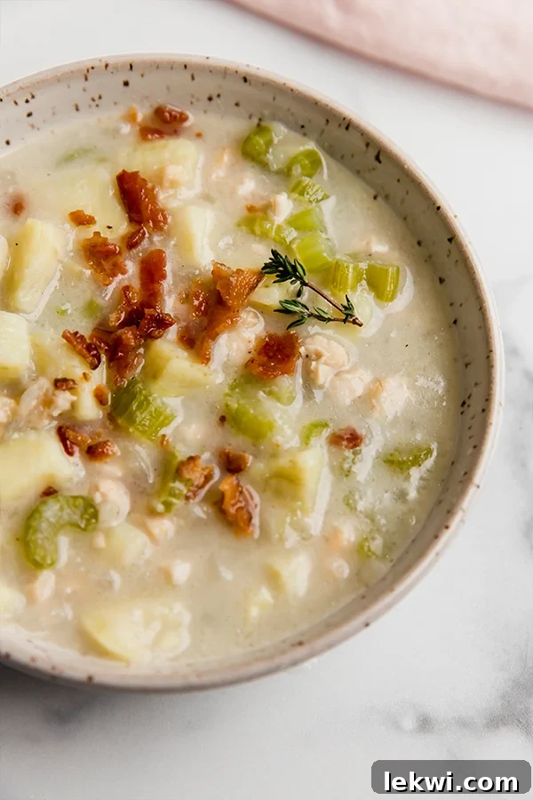 Bowl of clam chowder, highlighting its creamy texture.