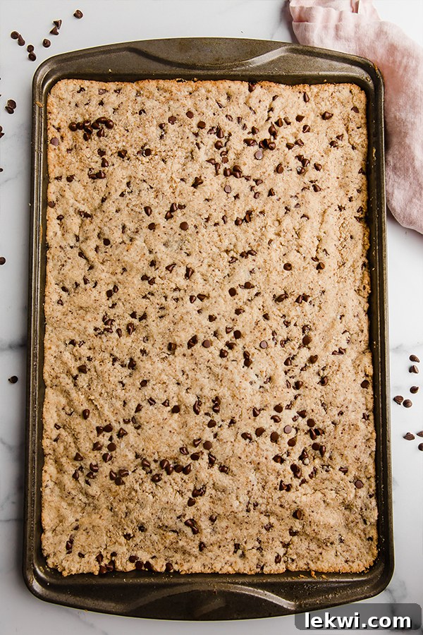 sheet pan chocolate chip cookie on pan before slicing