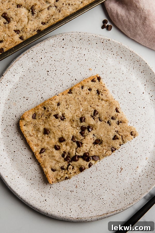 slice of sheet pan chocolate chip cookie on plate