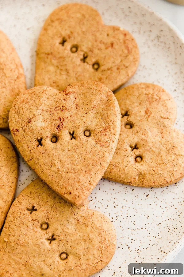 Conversation Heart Sugar Cookies stamped with XOXO and a heart, symbolizing healthy Valentine's treats.