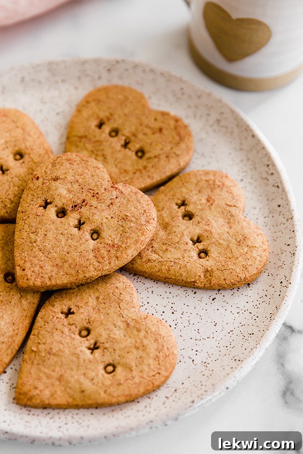 A festive spread of conversation heart sugar cookies, paleo and AIP, perfect for Valentine's Day celebrations.