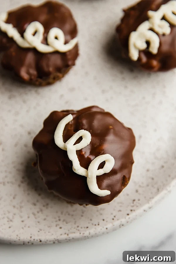 Copycat ding dong cupcake topped with a swirl of icing.