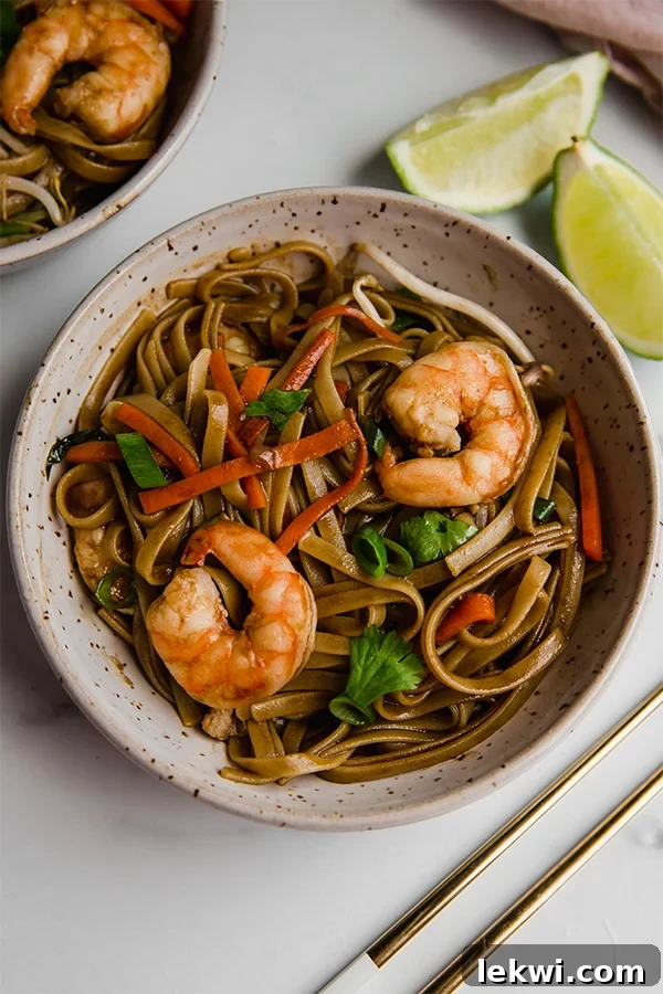gluten free pad thai in bowl with chopsticks