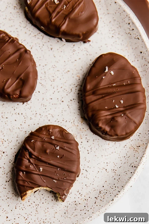 Chocolate-covered cookie dough Easter eggs arranged beautifully on a plate, ready to be enjoyed.