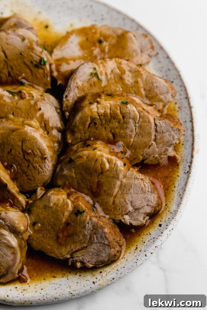 Instant Pot Pork Tenderloin sliced on a plate, ready to serve