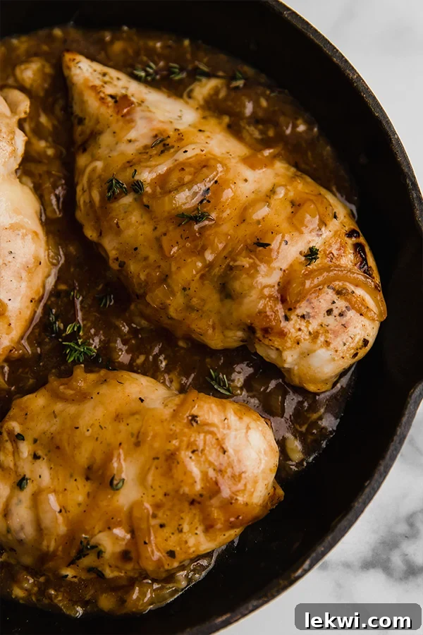 Close up of French onion chicken in cast iron skillet