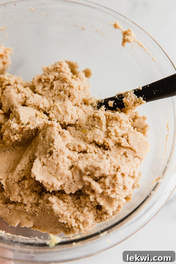 Thick coconut flour lemon banana cake batter in a mixing bowl, ready for baking.