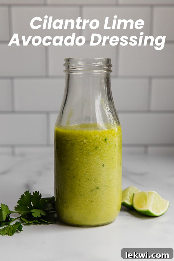 Jar labeled "Cilantro Lime Avocado Dressing," showing its creamy green texture.