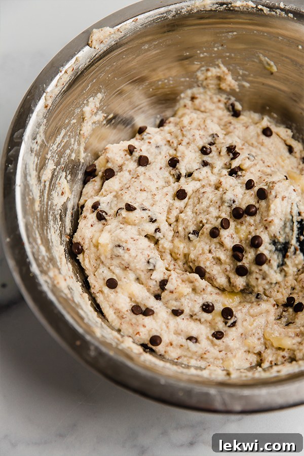 Close-up of freshly prepared banana bread donut batter, smooth and ready for piping into the pan.