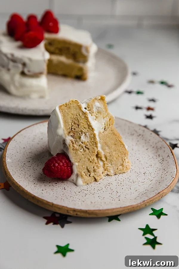 Slice of a beautifully decorated baby smash cake on a plate, ready to be enjoyed.