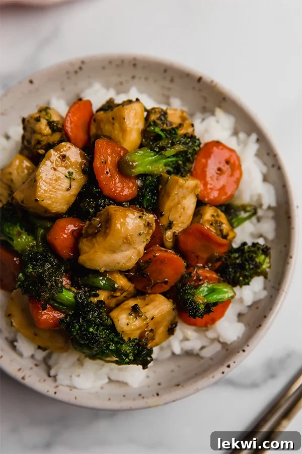 Delicious Honey Garlic Chicken Stir Fry served over a bed of rice.